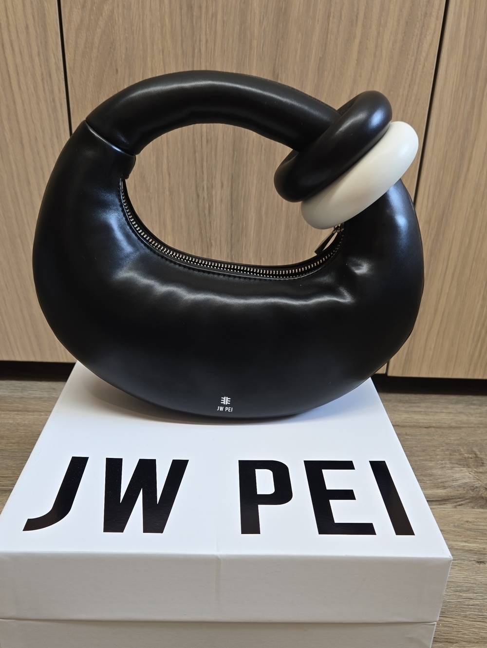 JW PEI Black Crescent Handle Bag with White Accent Ring